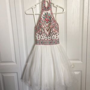 Formal white dress with exotic design in front
